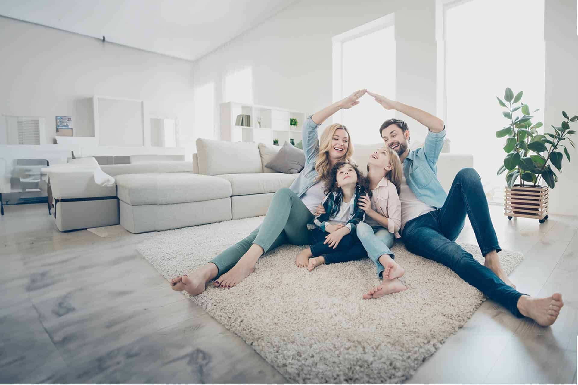 Happy Family Making Roof with Hands