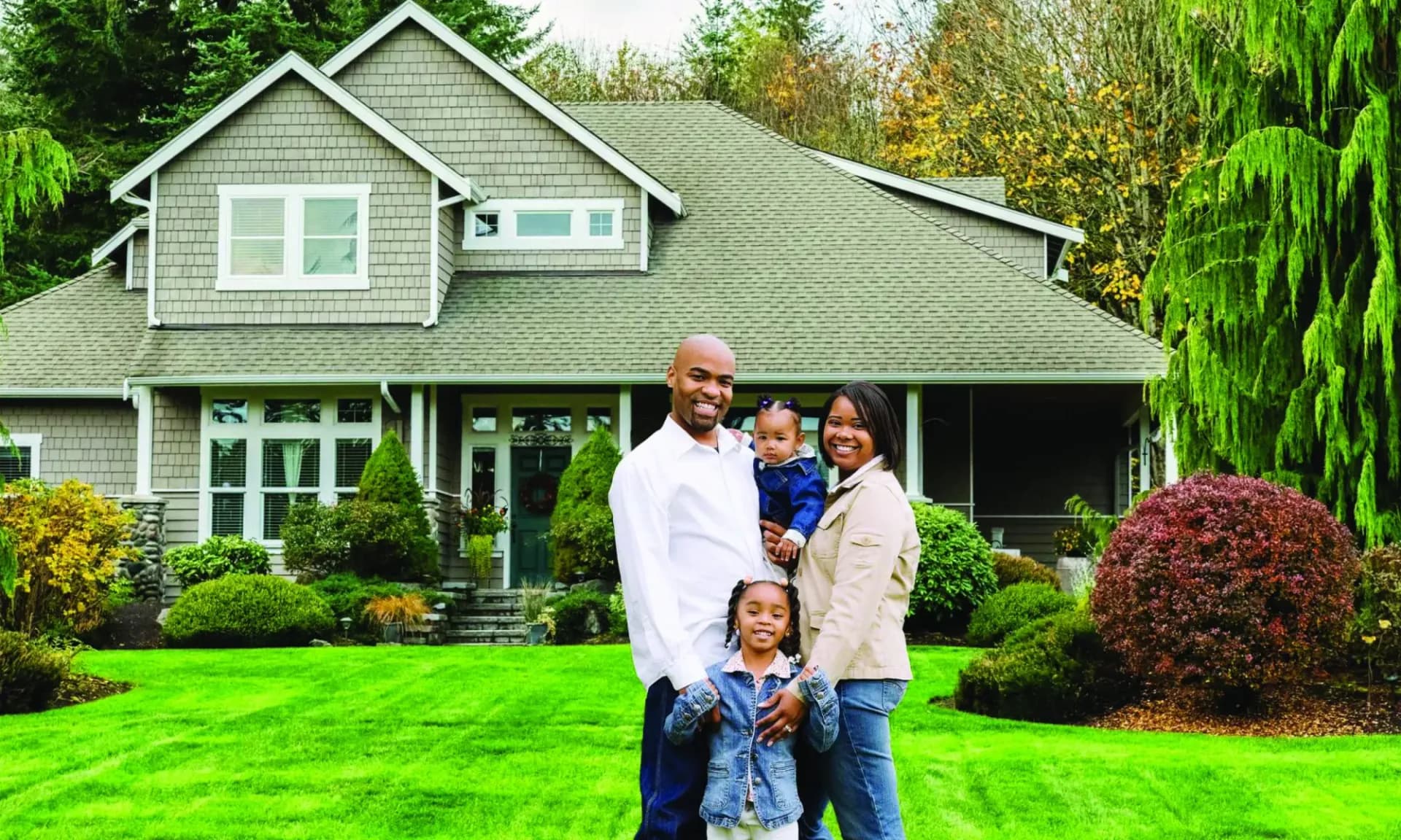 Family in front of house