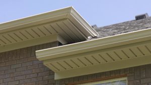 A white gutter system installed on a home